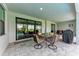 Relaxing screened patio with outdoor seating area and views of the pool at 237 W Pine Valley Ln, Rotonda West, FL 33947
