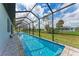 Enjoy the long view from this screened in pool, perfect for swimming laps and entertaining at 237 W Pine Valley Ln, Rotonda West, FL 33947