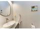 Contemporary powder room featuring a vessel sink, modern fixtures, and decorative accents at 237 W Pine Valley Ln, Rotonda West, FL 33947