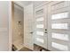 Powder room with modern door and decorative wall art at 237 W Pine Valley Ln, Rotonda West, FL 33947