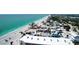 Expansive aerial view featuring beachfront homes nestled along the pristine shoreline, enhanced by clear blue waters at 40 Sand Dollar Ln, Englewood, FL 34223