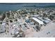 Aerial view of neighborhood, highlighting home's location to the beach and surrounding community at 40 Sand Dollar Ln, Englewood, FL 34223