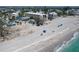 Breathtaking view of pristine beach with clear waters and white sand near a residential area at 40 Sand Dollar Ln, Englewood, FL 34223