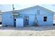 Exterior shot of a light-blue single-Gathering home with multiple entry points at 40 Sand Dollar Ln, Englewood, FL 34223