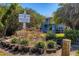 Community sign amidst lush landscaping, showcasing the condos at Harbour Village at 4410 Warren Ave # 110, Port Charlotte, FL 33953