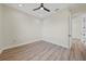 Bright bedroom featuring a ceiling fan and wood-look floors at 443 Boundary Blvd, Rotonda West, FL 33947