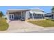 Charming single-story home with a covered carport and well-maintained landscaping at 5703 Holiday Park Blvd, North Port, FL 34287