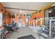 Spacious garage featuring unique decor and ample room for recreation and storage at 5703 Holiday Park Blvd, North Port, FL 34287