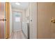 Functional laundry room with washer, dryer, ample storage, and exterior access at 5703 Holiday Park Blvd, North Port, FL 34287