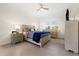 Bright bedroom with ceiling fan, neutral paint, and plenty of natural light at 677 Barnacle Ct, Englewood, FL 34223