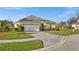 Beautifully maintained lawn and landscaping complement the home at 677 Barnacle Ct, Englewood, FL 34223