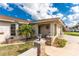 Charming single-story home with neat landscaping, stone accents, and an inviting front entrance at 7084 Tuxedo St, Englewood, FL 34224