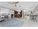 Inviting living area showcasing the layout, with a kitchen bar and a cozy dining area at 7084 Tuxedo St, Englewood, FL 34224