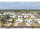An aerial view shows this quiet residential neighborhood with single-story homes and verdant landscaping at 8436 Buttonquail Dr, Englewood, FL 34224