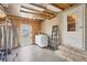 A practical basement space with laundry setup, utility access, and ample storage potential at 8436 Buttonquail Dr, Englewood, FL 34224