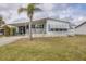 Charming single-story home with a covered carport and a cozy front porch at 8436 Buttonquail Dr, Englewood, FL 34224