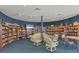 Cozy library with bookshelves and comfortable seating at 8436 Buttonquail Dr, Englewood, FL 34224