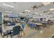 Brightly lit meeting room with tables and chairs at 8436 Buttonquail Dr, Englewood, FL 34224