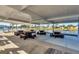 Covered outdoor seating area with picnic tables, perfect for gatherings and enjoying community views at 8436 Buttonquail Dr, Englewood, FL 34224