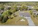 An aerial view of a single-Gathering home with a private pool, boat dock, and mature landscaping at 975 Clearview Dr, Port Charlotte, FL 33953