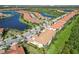 View of homes and landscaping, roads, and lakes within this beautiful community at 10063 Crooked Creek Dr # 103, Venice, FL 34293