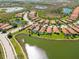 Aerial view of a neighborhood with various homes, ponds, and natural landscapes at 10508 Crooked Creek Dr, Venice, FL 34293