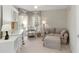 A bedroom featuring a writing desk, sofa, and natural light at 10508 Crooked Creek Dr, Venice, FL 34293