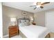 Comfortable bedroom showcasing a decorative iron bed frame, neutral tones, and ample natural light at 10508 Crooked Creek Dr, Venice, FL 34293