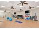 Bright fitness center with exercise equipment and mirrored wall at 10508 Crooked Creek Dr, Venice, FL 34293