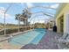 View of pool enclosed in lanai with outdoor furniture and barbecue in a backyard setting at 10508 Crooked Creek Dr, Venice, FL 34293
