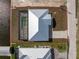 Birds eye view of a single Gathering home on a large lot with a screen enclosed patio, and situated on a canal at 10688 Mcalester Cir, Port Charlotte, FL 33981
