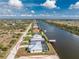 Aerial view of the property showcasing its location on the canal at 10688 Mcalester Cir, Port Charlotte, FL 33981