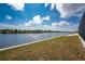 Wide view of the back yard with view of the water at 10688 Mcalester Cir, Port Charlotte, FL 33981
