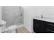 Well-lit bathroom with modern fixtures, a walk-in shower, and stylish vanity at 10688 Mcalester Cir, Port Charlotte, FL 33981
