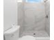 Bathroom featuring a walk-in shower with elegant tile work and modern fixtures at 10688 Mcalester Cir, Port Charlotte, FL 33981