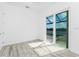 A bedroom that opens onto a lanai with a view of a body of water at 10688 Mcalester Cir, Port Charlotte, FL 33981