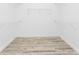 Walk-in closet with wood-look flooring and wire shelving for storage at 10688 Mcalester Cir, Port Charlotte, FL 33981