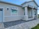 Charming home exterior featuring stone accents, modern windows, and well-maintained landscaping at 10688 Mcalester Cir, Port Charlotte, FL 33981