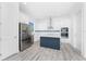 Beautiful modern kitchen with stainless steel appliances and island at 10688 Mcalester Cir, Port Charlotte, FL 33981