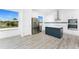 Modern kitchen with stainless steel appliances and blue island at 10688 Mcalester Cir, Port Charlotte, FL 33981