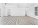 Open living room with plenty of space and natural lighting at 10688 Mcalester Cir, Port Charlotte, FL 33981