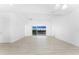 Open living space with large glass doors leading to outdoor patio at 10688 Mcalester Cir, Port Charlotte, FL 33981