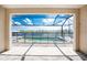 Screened in pool offering scenic water views and outdoor entertaining space at 10688 Mcalester Cir, Port Charlotte, FL 33981