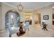 Inviting foyer with stylish decor, archways, and views of the dining and living spaces at 10953 Bullrush Dr, Venice, FL 34293