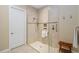 An elegant walk-in shower with glass enclosure and decorative tile accents at 10953 Bullrush Dr, Venice, FL 34293