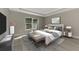 Beautiful bedroom with a tray ceiling, large window, and stylish gray decor at 1183 Cedar Ave, Englewood, FL 34223