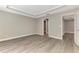 An airy bedroom with sleek gray flooring, tray ceilings, and well-lit open space at 1183 Cedar Ave, Englewood, FL 34223