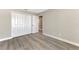 Bright bedroom featuring sleek gray flooring and a spacious closet for ample storage at 1183 Cedar Ave, Englewood, FL 34223