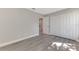 Bedroom with closet and gray flooring provides a clean and open living space at 1183 Cedar Ave, Englewood, FL 34223