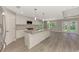 Spacious kitchen featuring a large island, stainless steel appliances, and an open floor plan at 1183 Cedar Ave, Englewood, FL 34223